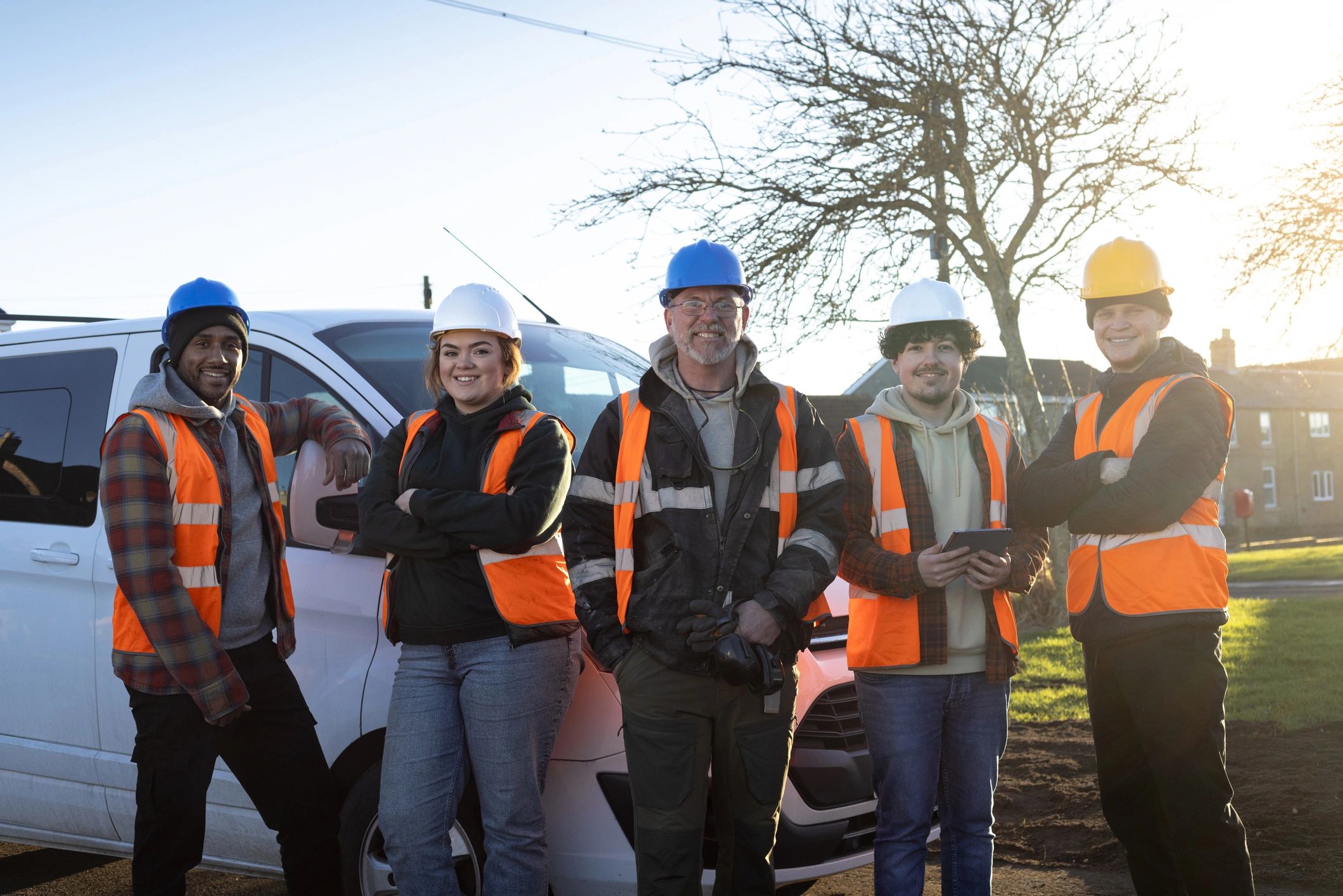 Utility work crew standing together at a jobsite
